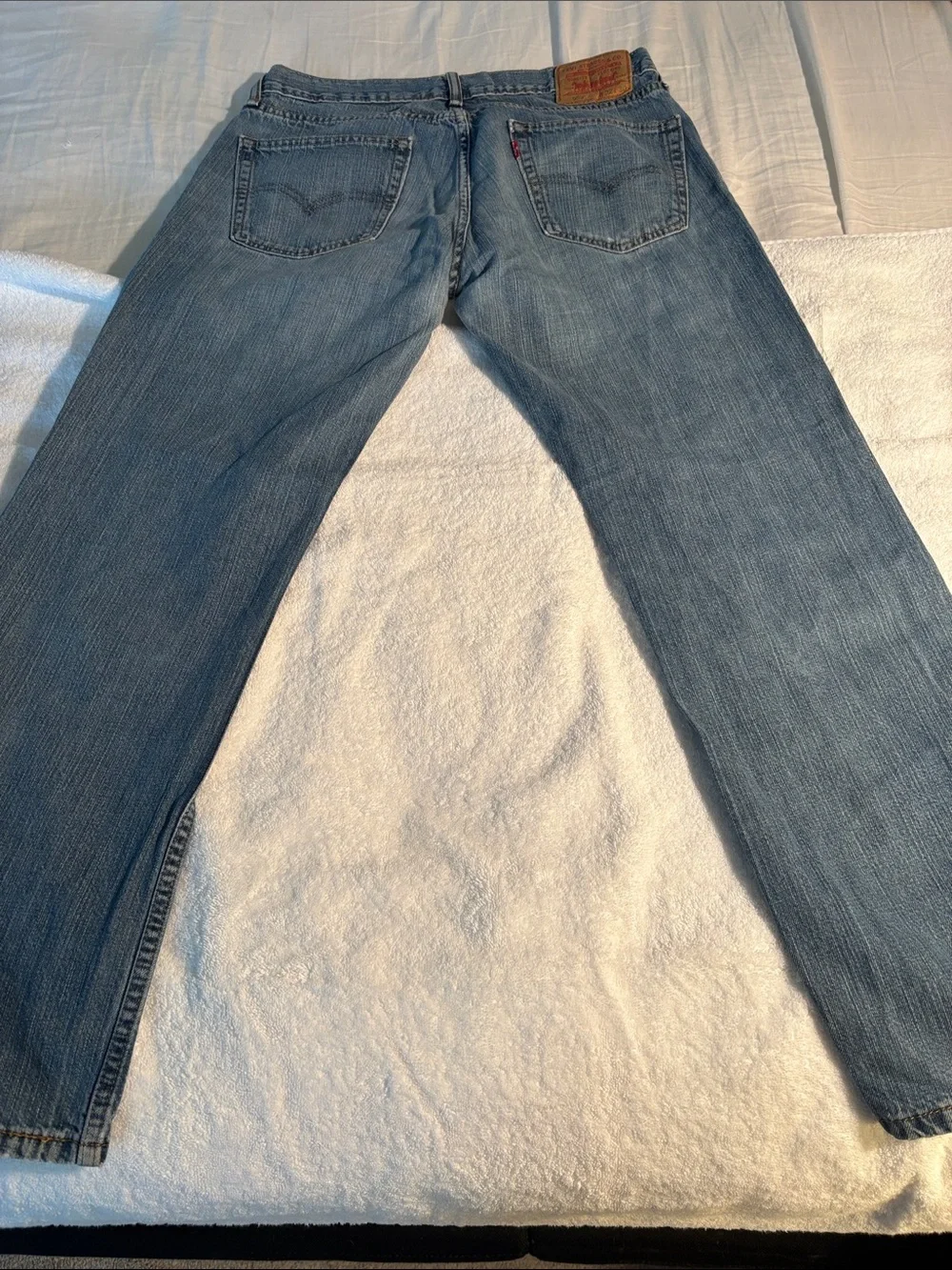 Levi's 559 - Faded Light Blue Jeans with distressing at the knee